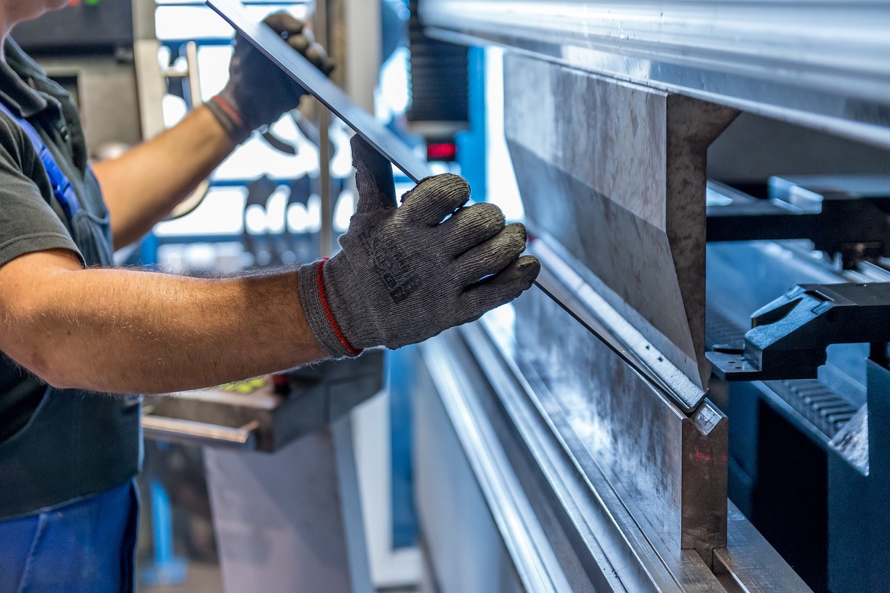 Operator forming a sheet-metal part on a press brake
