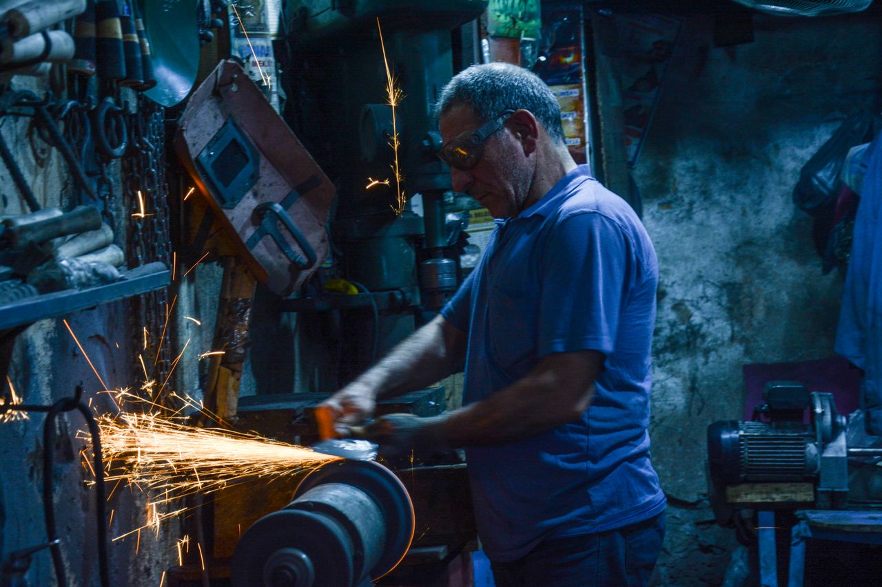 Sheet-metal parts passing through an industrial deburring process